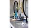 Bathroom sink with flowers and towel basket at 445 Panoramic Dr, Monument, CO 80132