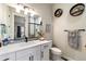 Bathroom with a large mirror, toilet, and bath towels at 445 Panoramic Dr, Monument, CO 80132