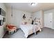 Charming bedroom with a hanging chair, creating a cozy and inviting space at 445 Panoramic Dr, Monument, CO 80132