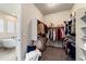 Spacious walk-in closet featuring ample storage and an attached bath with soaking tub at 445 Panoramic Dr, Monument, CO 80132