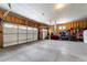 A spacious, unfinished garage, offering multiple parking bays and potential storage space at 445 Panoramic Dr, Monument, CO 80132