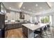 Bright kitchen features a large island, stainless steel appliances, and ample cabinet space for culinary enthusiasts at 445 Panoramic Dr, Monument, CO 80132