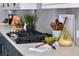 Close up of the kitchen cooktop with modern appliances and stylish countertops for a gourmet cooking experience at 445 Panoramic Dr, Monument, CO 80132