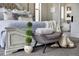 Close-up of a beautifully decorated main bedroom featuring an accent chair at 445 Panoramic Dr, Monument, CO 80132