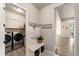 Mudroom with a bench, hooks, and access to the laundry room at 445 Panoramic Dr, Monument, CO 80132