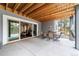 Covered patio with outdoor seating with an adjacent rec room or gym at 445 Panoramic Dr, Monument, CO 80132