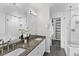 Bathroom featuring double sinks with granite countertop and a glass-enclosed shower at 152 S Jackson St, Denver, CO 80209
