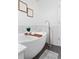 Bright bathroom features a modern soaking tub with sleek faucet fixtures and tiled walls at 152 S Jackson St, Denver, CO 80209