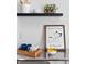 Decorated counter features espresso station, lemons, plants, white ceramics, and black floating shelves at 152 S Jackson St, Denver, CO 80209