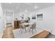 Bright dining room featuring modern decor, a marble dining table, and convenient wine storage at 152 S Jackson St, Denver, CO 80209