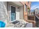 Front door entrance of a home with a small patio area and brick accents at 152 S Jackson St, Denver, CO 80209