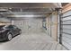 Attached garage with an electric vehicle charging station, ample space for parking, and convenient storage options at 152 S Jackson St, Denver, CO 80209