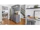 Efficient kitchen layout with stainless steel appliances and adjacent staircase at 152 S Jackson St, Denver, CO 80209