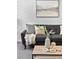 Living room close up featuring a comfy sofa and modern mountain themed artwork at 152 S Jackson St, Denver, CO 80209