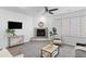 Cozy living room features a modern fireplace and plenty of natural light from a large window at 152 S Jackson St, Denver, CO 80209
