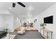 Open living room with modern decor seamlessly connects to the dining area at 152 S Jackson St, Denver, CO 80209