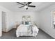 Bright main bedroom with a ceiling fan, neutral color palette, and comfortable bedding at 152 S Jackson St, Denver, CO 80209