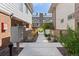 Exterior walkway with mature landscaping, leading to the townhome, and featuring a communal mailbox at 152 S Jackson St, Denver, CO 80209
