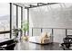 Bright living room featuring floor-to-ceiling windows and modern decor at 545 Strada Rossa Rd, Golden, CO 80401