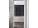 View of pantry featuring stylish black ribbed glass doors at 545 Strada Rossa Rd, Golden, CO 80401