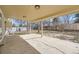 Cozy covered back patio extends to an expansive backyard, perfect for outdoor entertaining and relaxing at 1348 E Jamison Ave, Centennial, CO 80122