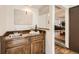 Cozy bar area with wood cabinets, sink, and stylish decor, perfect for entertaining guests at 1348 E Jamison Ave, Centennial, CO 80122