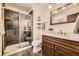 Stylish bathroom featuring a tiled shower, single sink vanity, and modern fixtures at 1348 E Jamison Ave, Centennial, CO 80122