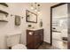 This bathroom includes stylish fixtures, mirror, and a tiled floor at 1348 E Jamison Ave, Centennial, CO 80122