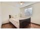 This quaint bedroom features hardwood floors, window, and ceiling fan at 1348 E Jamison Ave, Centennial, CO 80122