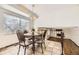 Bright breakfast nook featuring tile flooring and large window at 1348 E Jamison Ave, Centennial, CO 80122