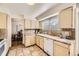 Charming kitchen featuring tiled countertops and floors with views of the dining area at 1348 E Jamison Ave, Centennial, CO 80122
