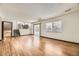 Spacious living area with access to an outdoor patio with an upper level dining area at 1348 E Jamison Ave, Centennial, CO 80122