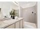 This full bathroom features a double vanity and tile shower at 23527 E 5Th Pl, Aurora, CO 80018