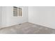 Bright bedroom with neutral carpet, light walls and a window that provides natural light into the room at 23527 E 5Th Pl, Aurora, CO 80018