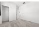 This bright bedroom features a closet and neutral carpet at 23527 E 5Th Pl, Aurora, CO 80018