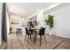 Bright dining area with stylish chairs, island, and modern decor at 23527 E 5Th Pl, Aurora, CO 80018