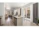 Modern kitchen island with stainless steel appliances and patio access at 23527 E 5Th Pl, Aurora, CO 80018
