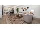Inviting living area with stylish rug, comfortable seating, and modern decor at 23527 E 5Th Pl, Aurora, CO 80018