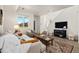 Comfortable living room with bright window, modern decor, and plush furnishings at 23527 E 5Th Pl, Aurora, CO 80018