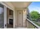 Inviting balcony with a view of a fireplace and a serene outdoor setting, creating a cozy retreat at 8775 W Berry Ave # 203, Littleton, CO 80123