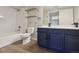 Stylish bathroom with modern vanity, fixtures, and shower-tub combination at 8775 W Berry Ave # 203, Littleton, CO 80123
