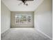 Bedroom features neutral color palette and plush carpeting at 8775 W Berry Ave # 203, Littleton, CO 80123