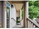 Welcoming entryway leading to unit 203, featuring a secure door and well-lit stairway at 8775 W Berry Ave # 203, Littleton, CO 80123