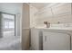 Convenient laundry room with washer and dryer at 8775 W Berry Ave # 203, Littleton, CO 80123