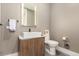 Elegant powder room with modern vanity, vessel sink, and illuminated mirror at 1901 Wazee St # 807, Denver, CO 80202