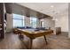 Game room with a pool table, modern lighting, and a view of the cityscape at 1901 Wazee St # 807, Denver, CO 80202