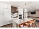 Modern kitchen featuring a marble waterfall island, stainless steel appliances, and sleek white cabinetry at 1901 Wazee St # 807, Denver, CO 80202