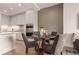 Modern kitchen blending into the dining area, featuring a kitchen island and stainless steel appliances at 1901 Wazee St # 807, Denver, CO 80202