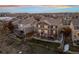 Aerial view showcasing the home's backyard, deck, and neighborhood setting at 10918 Bellbrook Cir, Highlands Ranch, CO 80130