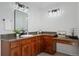 Bathroom boasts a large vanity with a granite countertop at 10918 Bellbrook Cir, Highlands Ranch, CO 80130